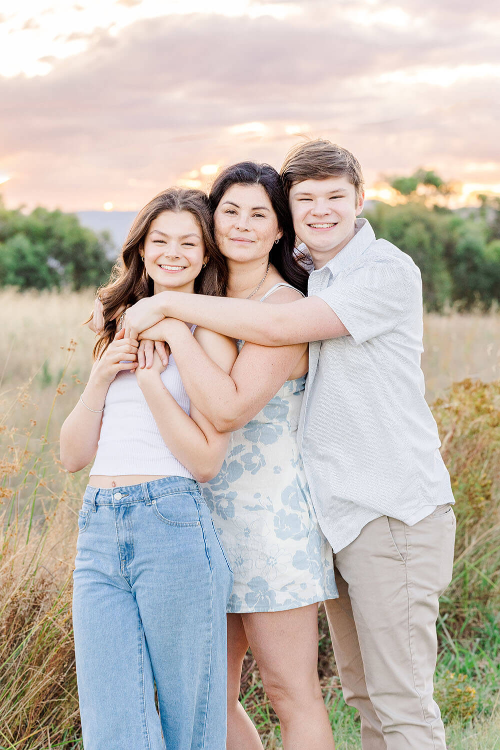 mother and son hugging mother in the middle